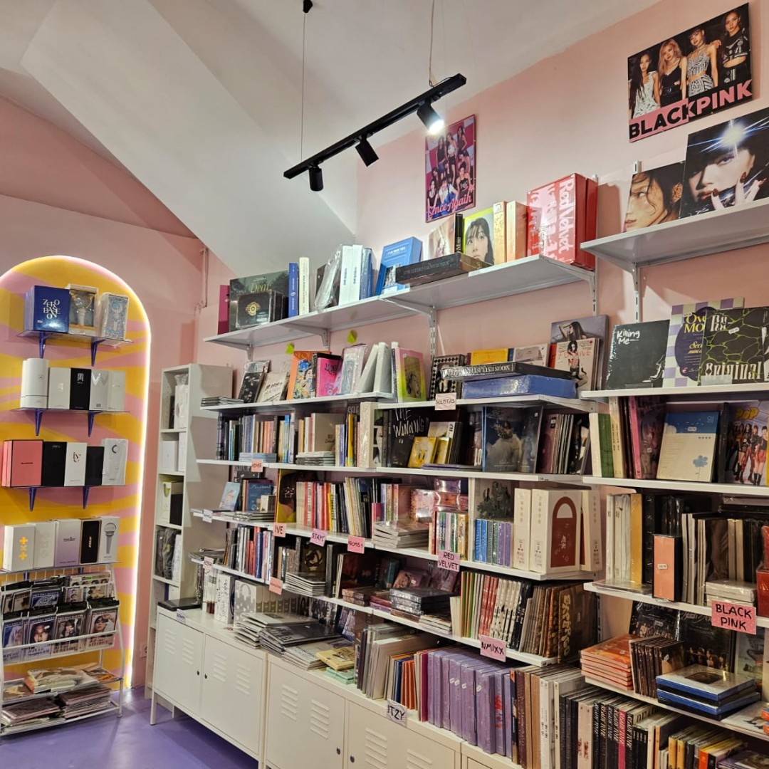 Wall of official K-pop albums at Momo Store Barcelona