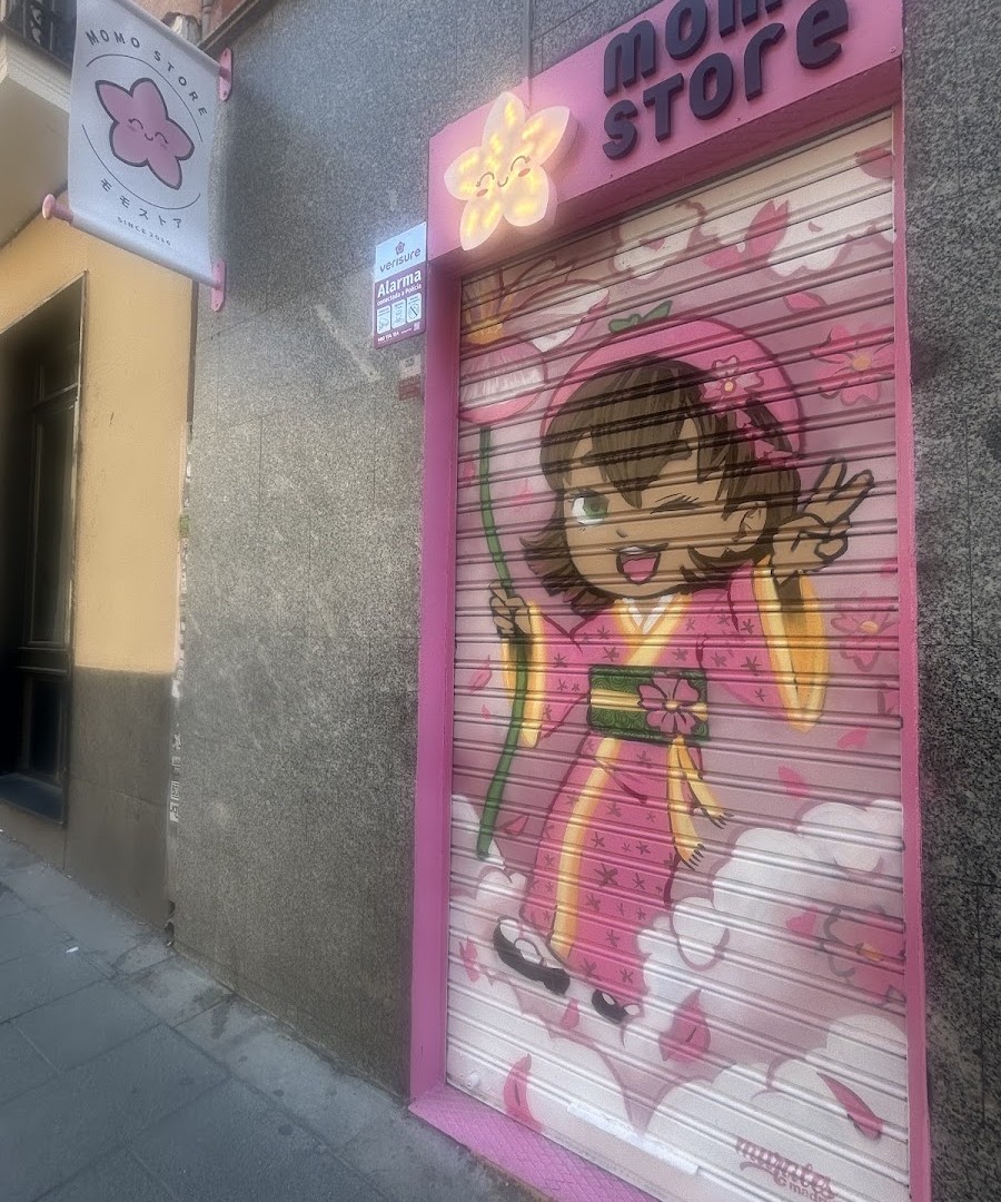 Momo Store Madrid shopfront with the painted shutter mural on Calle del Divino Pastor